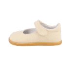 Merceditas infantil de lino beige con tira de velcro y suela de goma color miel, vista lateral