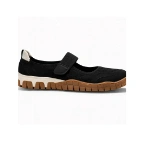 Zapato Coqueflex Lira negro tipo merceditas con tira de velcro, talón beige y suela marrón dentada, vista lateral