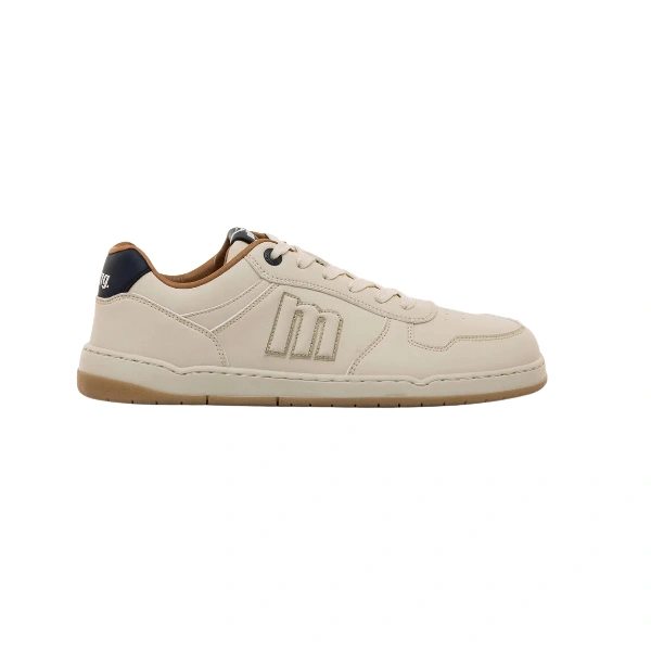 Zapatilla Mustang Free Miami de adulto en blanco roto, vista lateral, con logo «m» bordado, talón azul marino y suela de goma