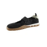 Zapato Coqueflex Lira negro tipo merceditas con tira elástica de velcro y suela color miel, vista lateral interior