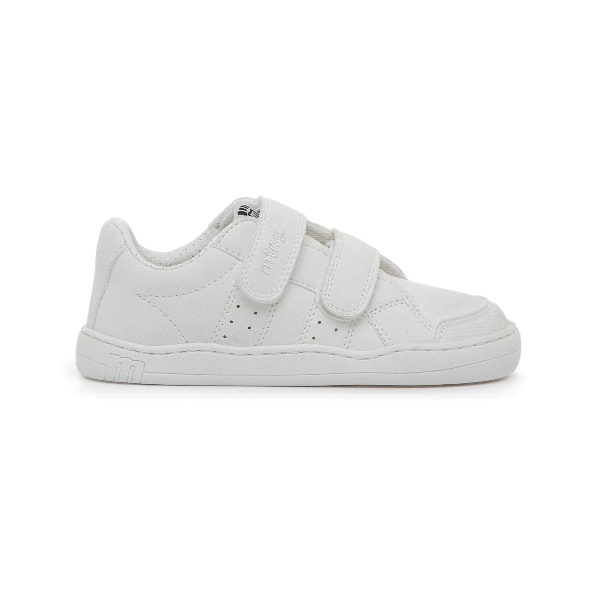 5 Zapatilla infantil Mustang Free Rise blanca con dos tiras de velcro y perforaciones laterales, vista de perfil